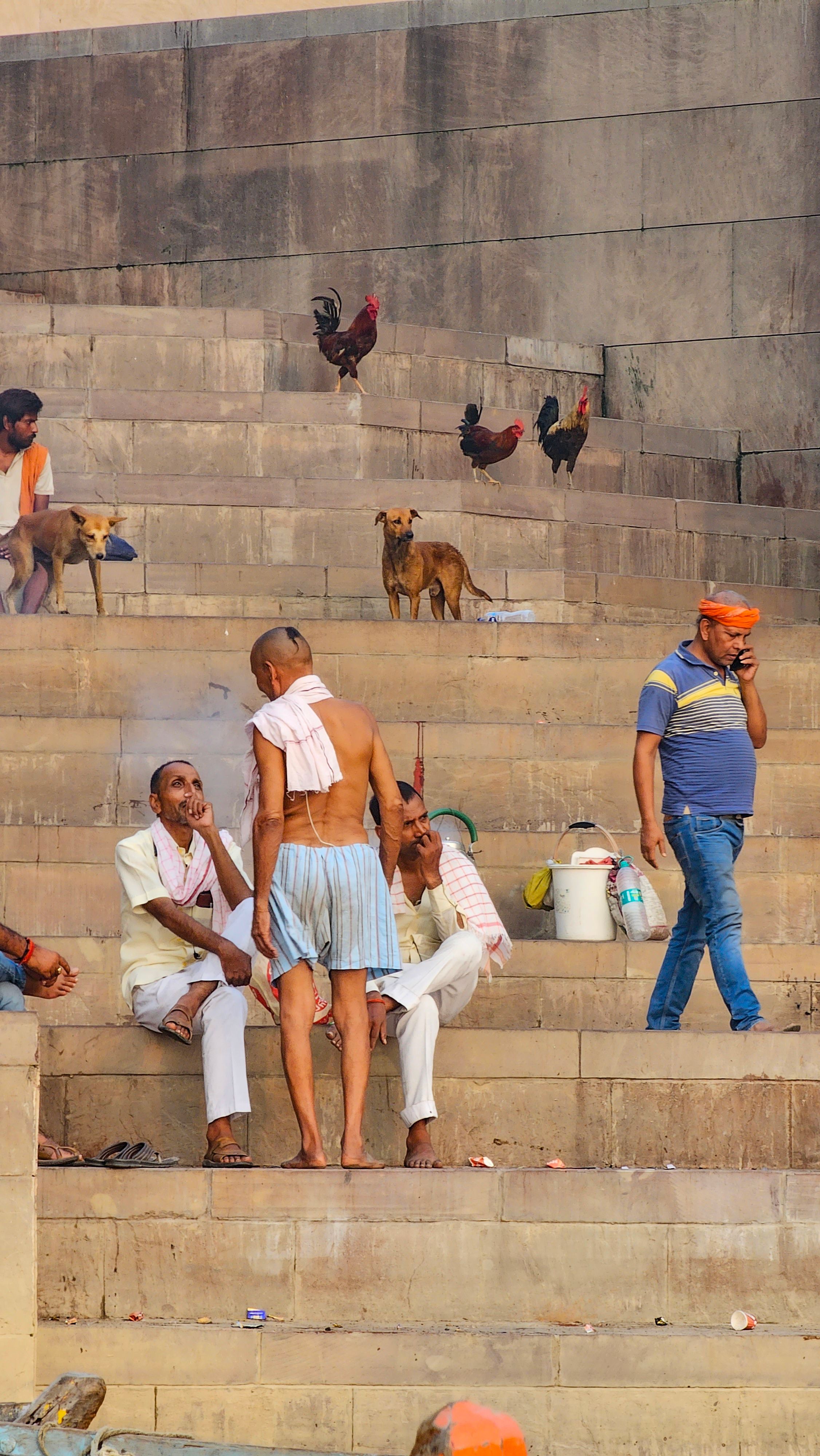 Capturing the vibrant life and interactions on the historic Ghats of Varanasi, India.