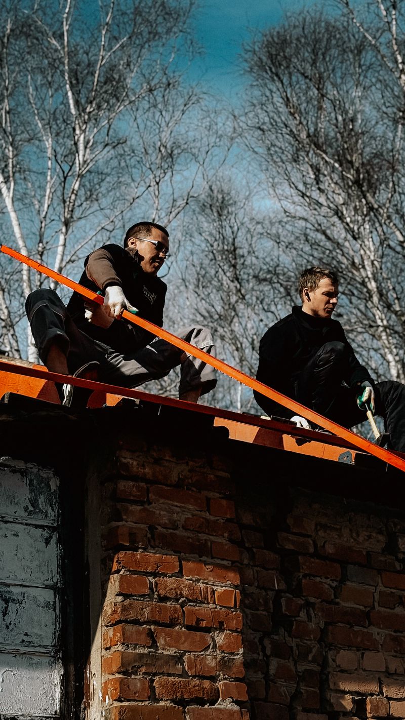 Roofing crew completing a storm damage reroof