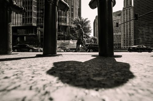 Free Dynamic urban scene capturing city life in Chicago with dramatic shadows and architecture. Stock Photo