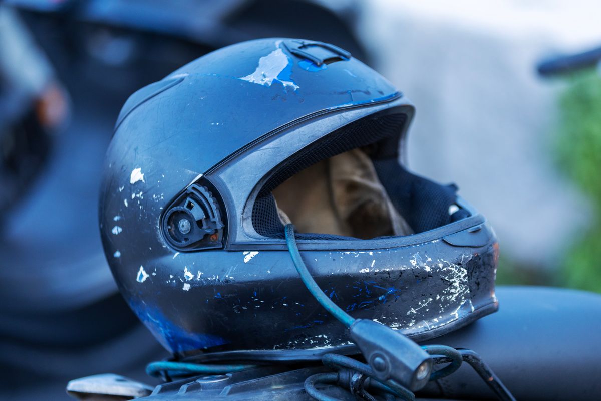 Damaged motorcycle helmet after impact