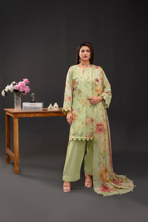 Free Woman in floral outfit posing indoors, showcasing fashion. Elegant and stylish. Stock Photo
