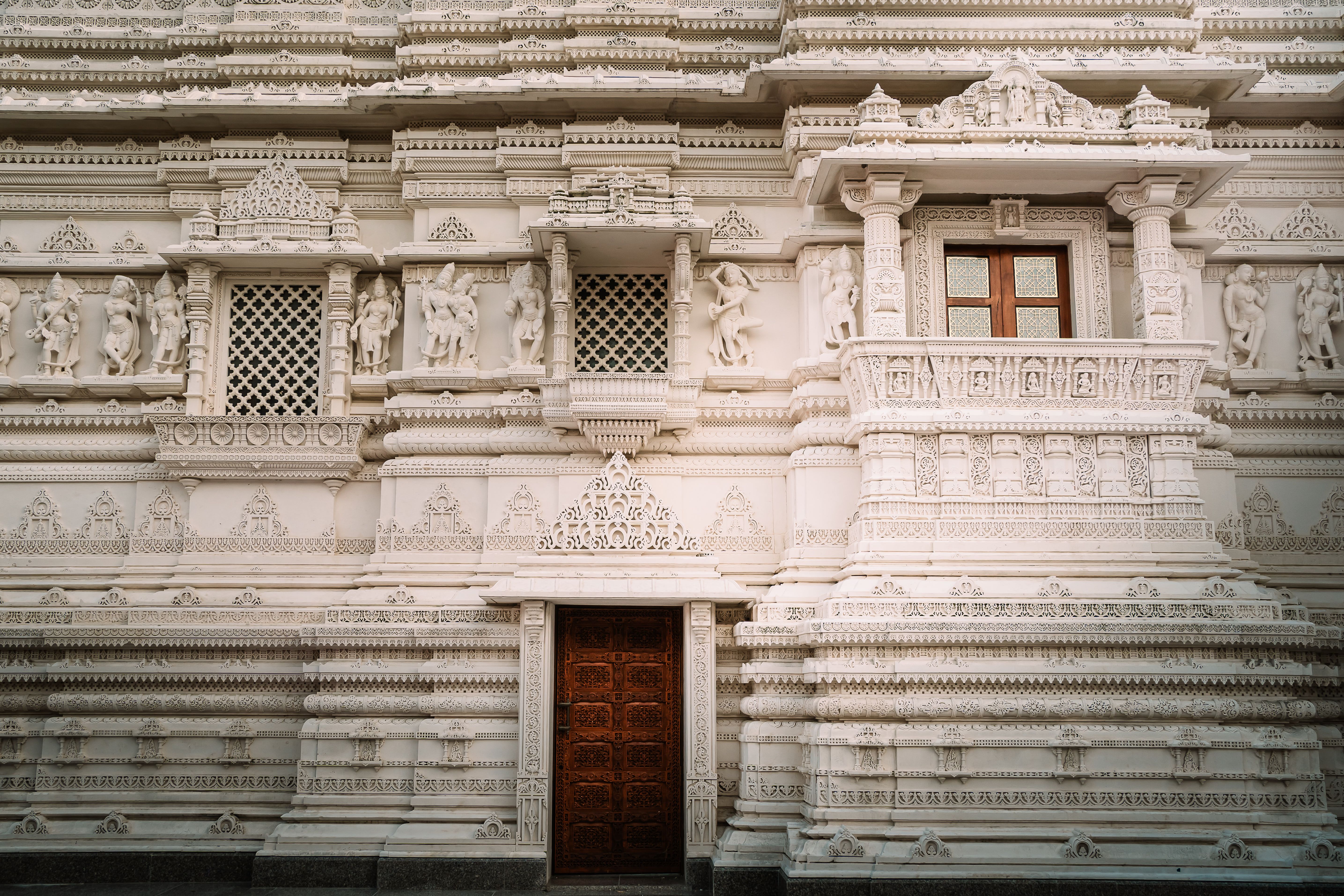 Ornate facade of a Hindu temple with intricate carvings and detailed sculptures in Bartlett, Illinois.