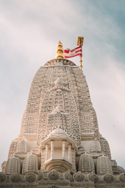 Free Detailed view of a Hindu temple facade in Bartlett, Illinois, showcasing intricate design and cultural symbols. Stock Photo