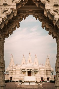 Beautiful Hindu temple framed by ornate archway in Bartlett, Illinois, USA.