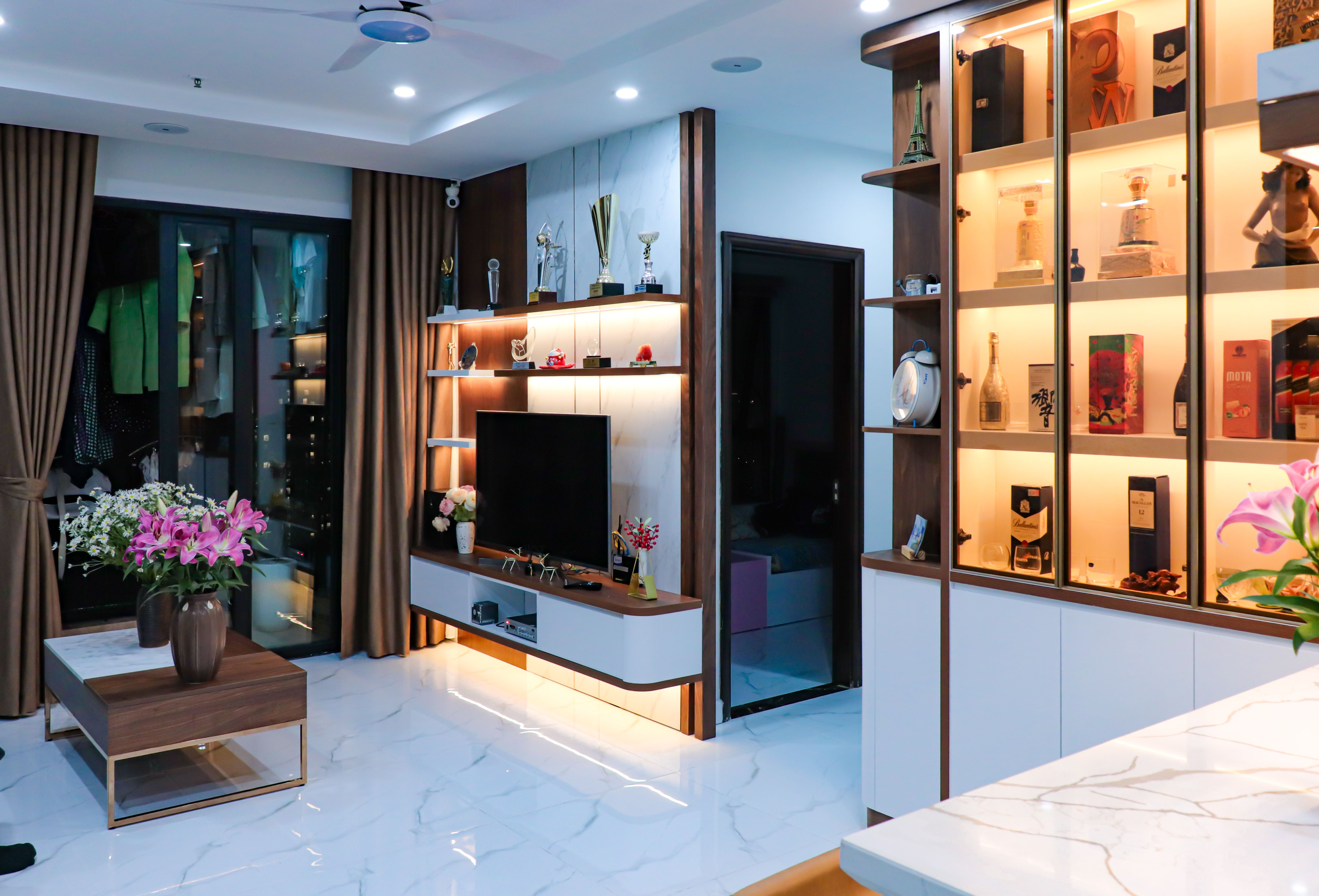 Minimalist living room with a narrow floating shelf and sleek furniture