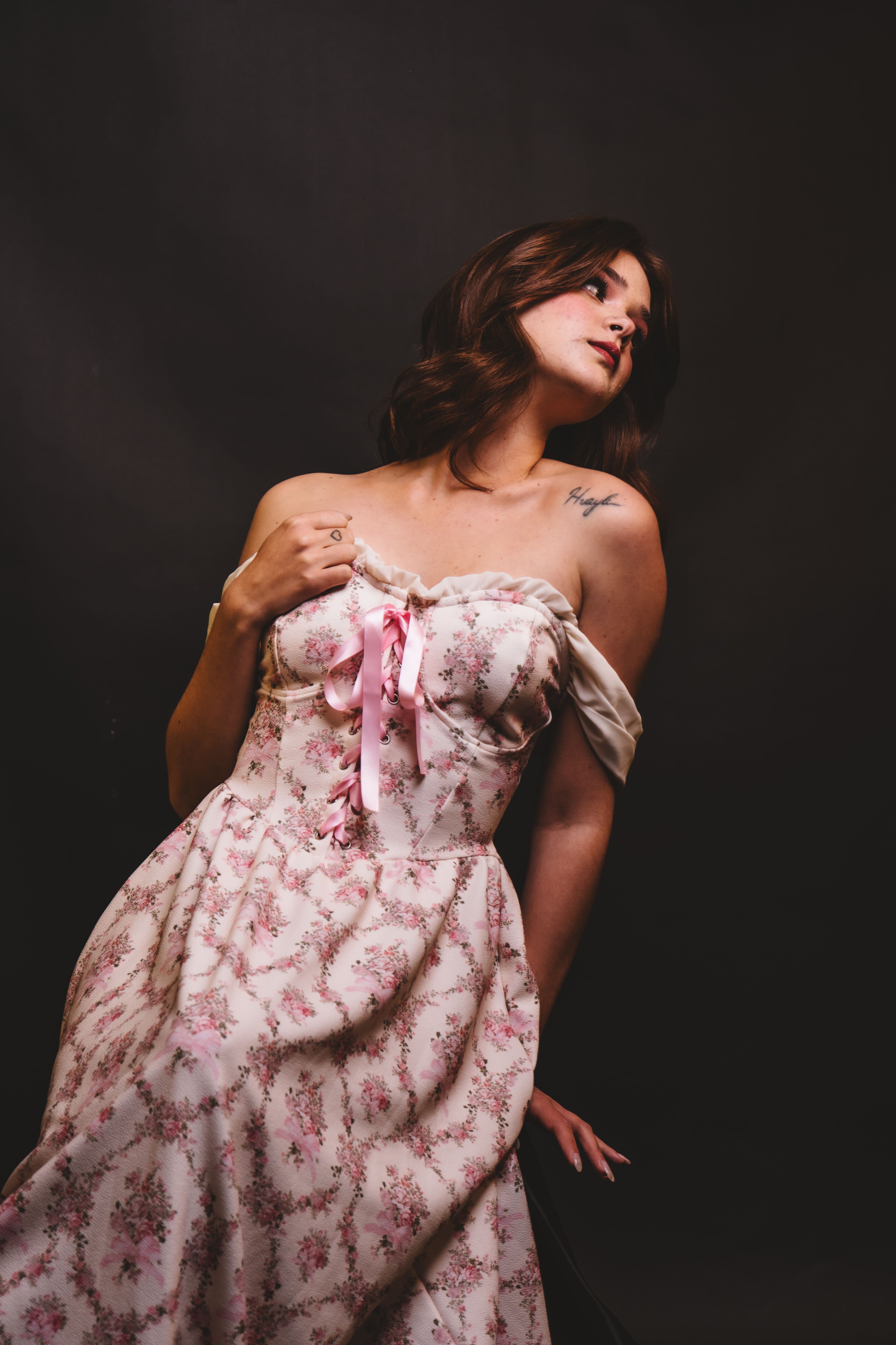 Elegant Woman in Floral Dress Studio Portrait · Free Stock Photo