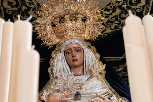 Free Detailed view of a Madonna statue adorned with candles during Semana Santa in San Fernando. Stock Photo