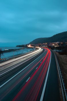 Nighttime long-exposure photo capturing light trails on a highway in Jönköping, Sweden.