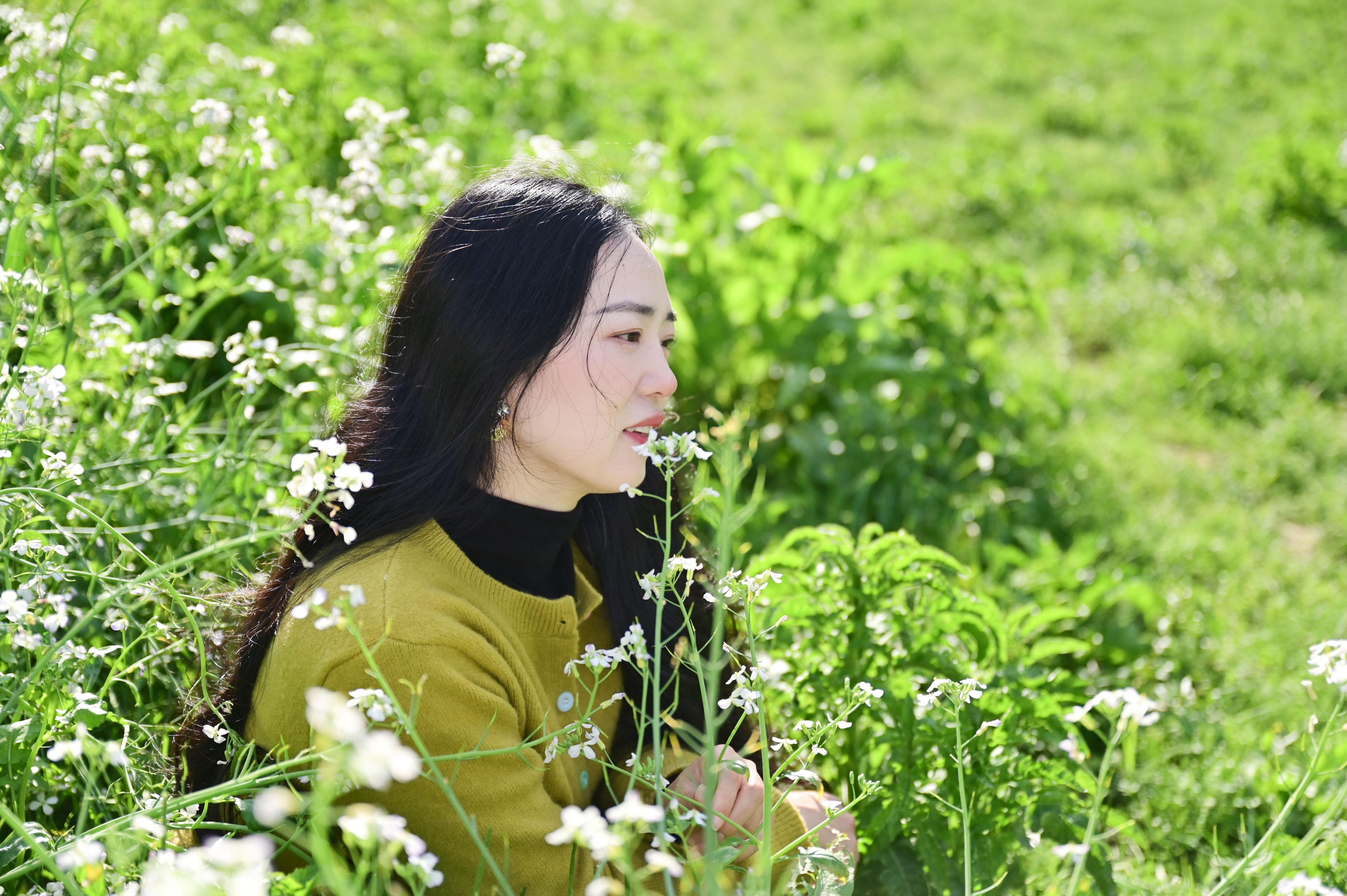 Woman in Green Field with White Flowers · Free Stock Photo