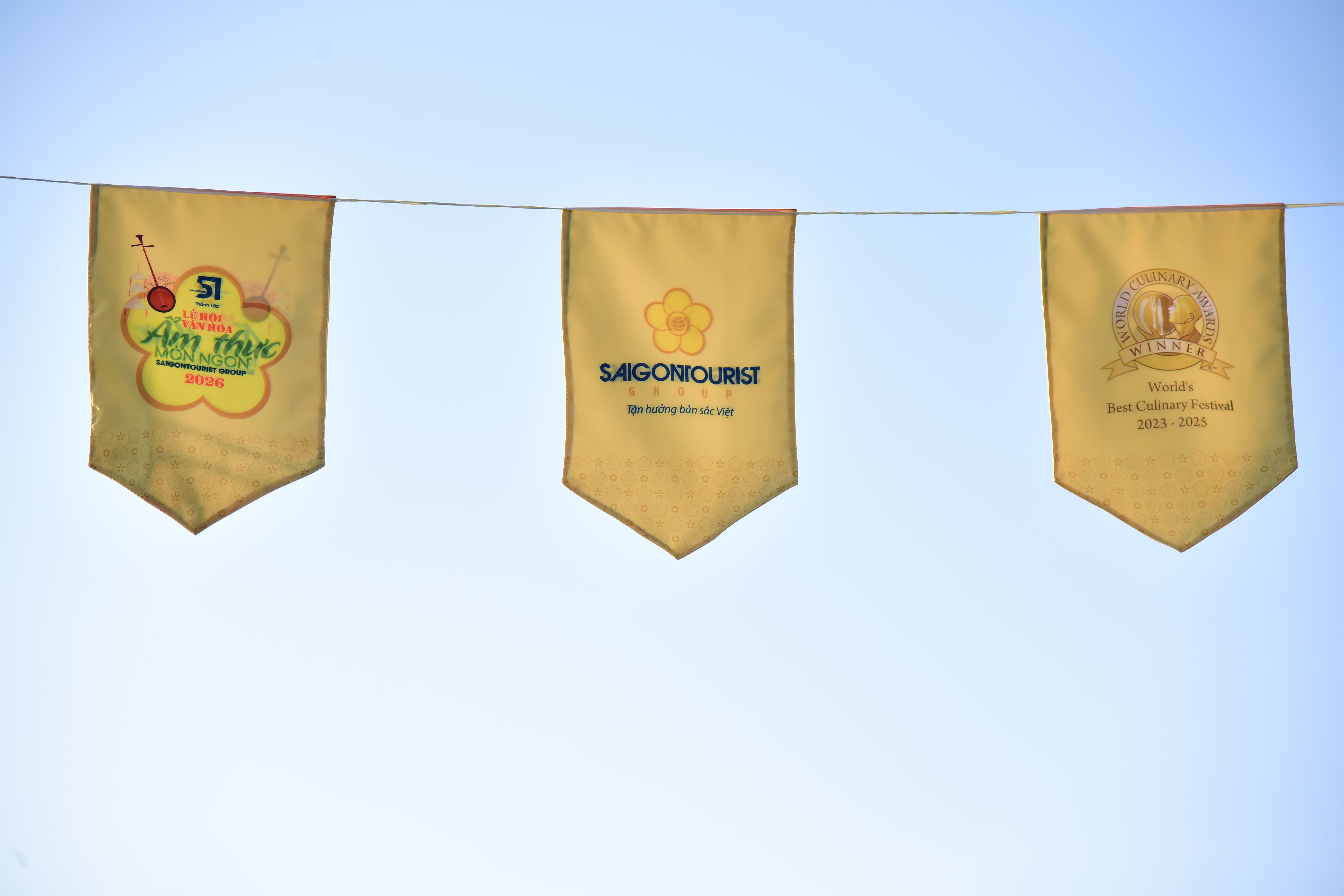 Colorful banners promoting a culinary festival with Saigontourist logo.