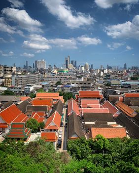 Discover Bangkok's blend of traditional temples and modern skyline in this vibrant cityscape panorama.