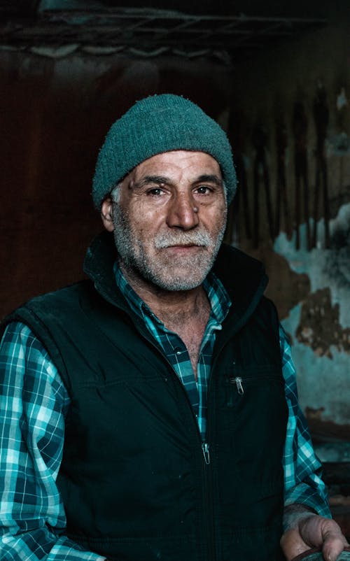 Portrait Photo of Elderly Man in Blue Jacket Wearing a Beanie hat