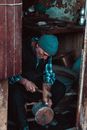 Poor man fixing pan with self made hammer