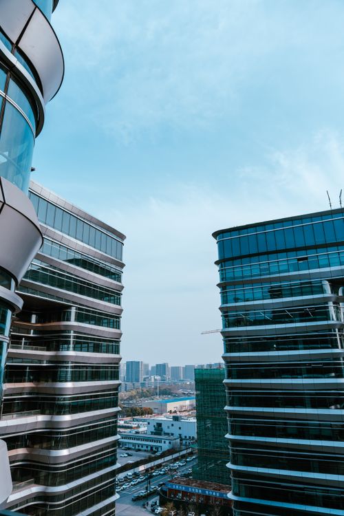 Free View of modern skyscrapers and skyline in Hangzhou, Zhejiang Province under a clear blue sky. Stock Photo