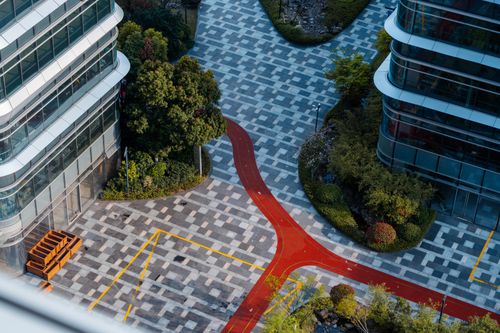 Free Aerial view of contemporary urban landscape in Hangzhou, featuring sleek skyscrapers and geometric pathways. Stock Photo