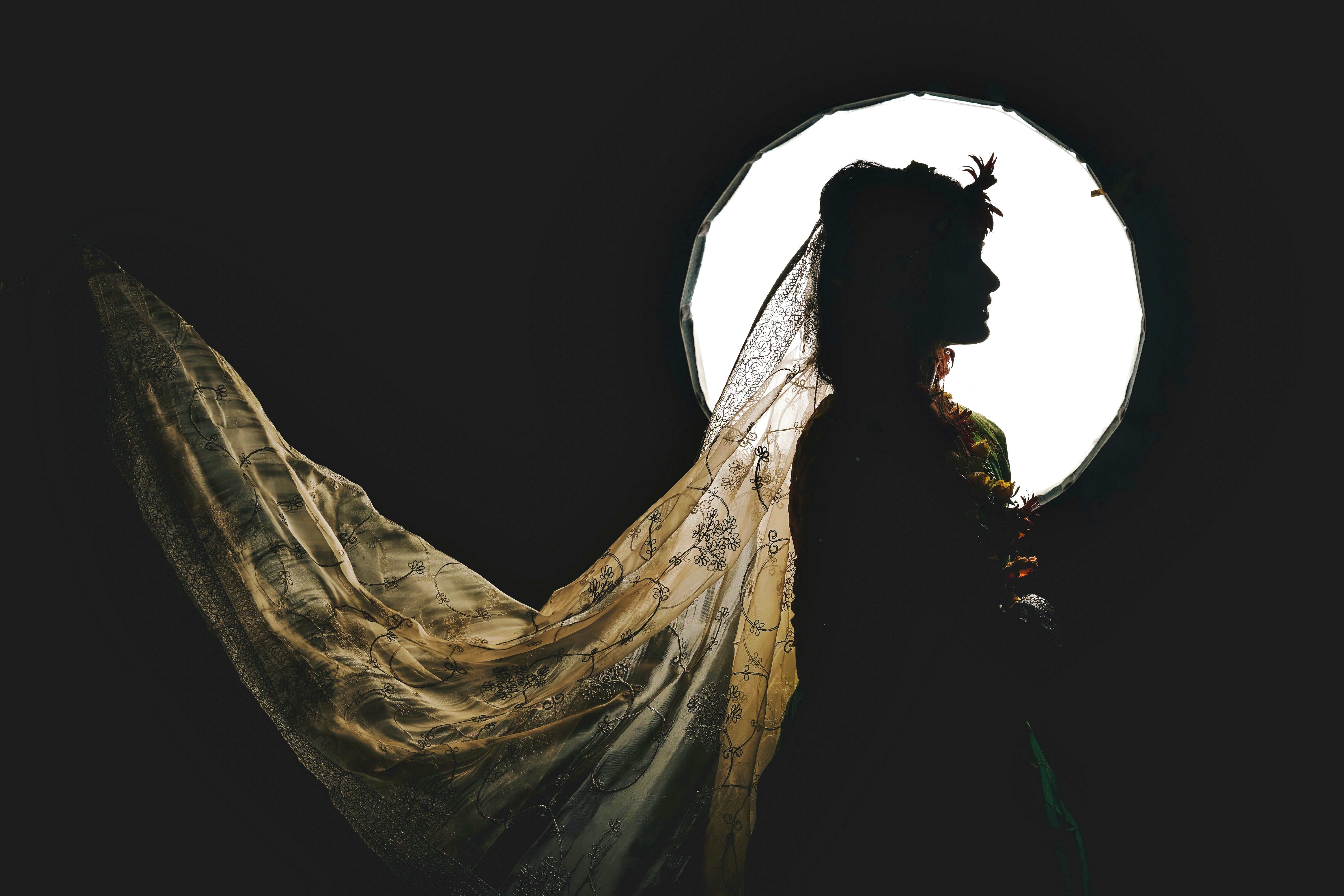An elegant bridal gown silhouette photographed in natural light