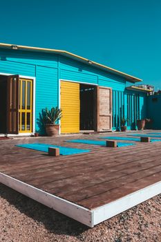 Colorful yoga studio with mats on a sunny day in Taghazout, Morocco.