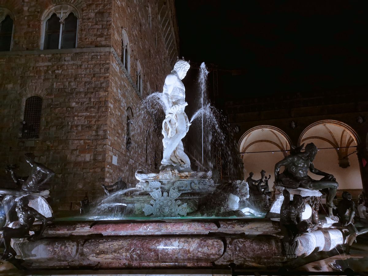 Neptune fountain Florence Piazza della Signoria white marble figure surrounded by bronze sea creatures