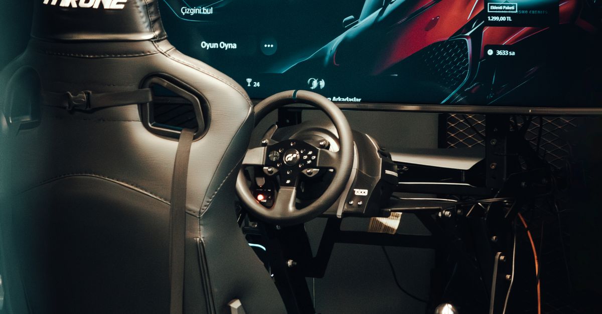 High Tech Racing Gaming Rig Flashy High-tech Gaming Setup with Racing Simulator Chair · Free Stock Photo