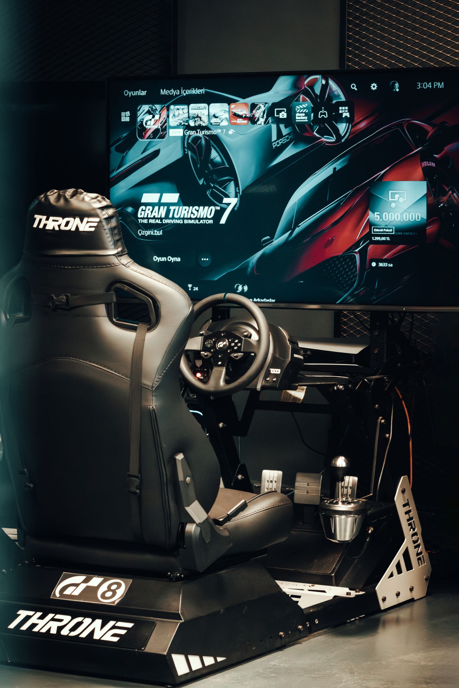 High-end gaming room with racing simulator chair and display