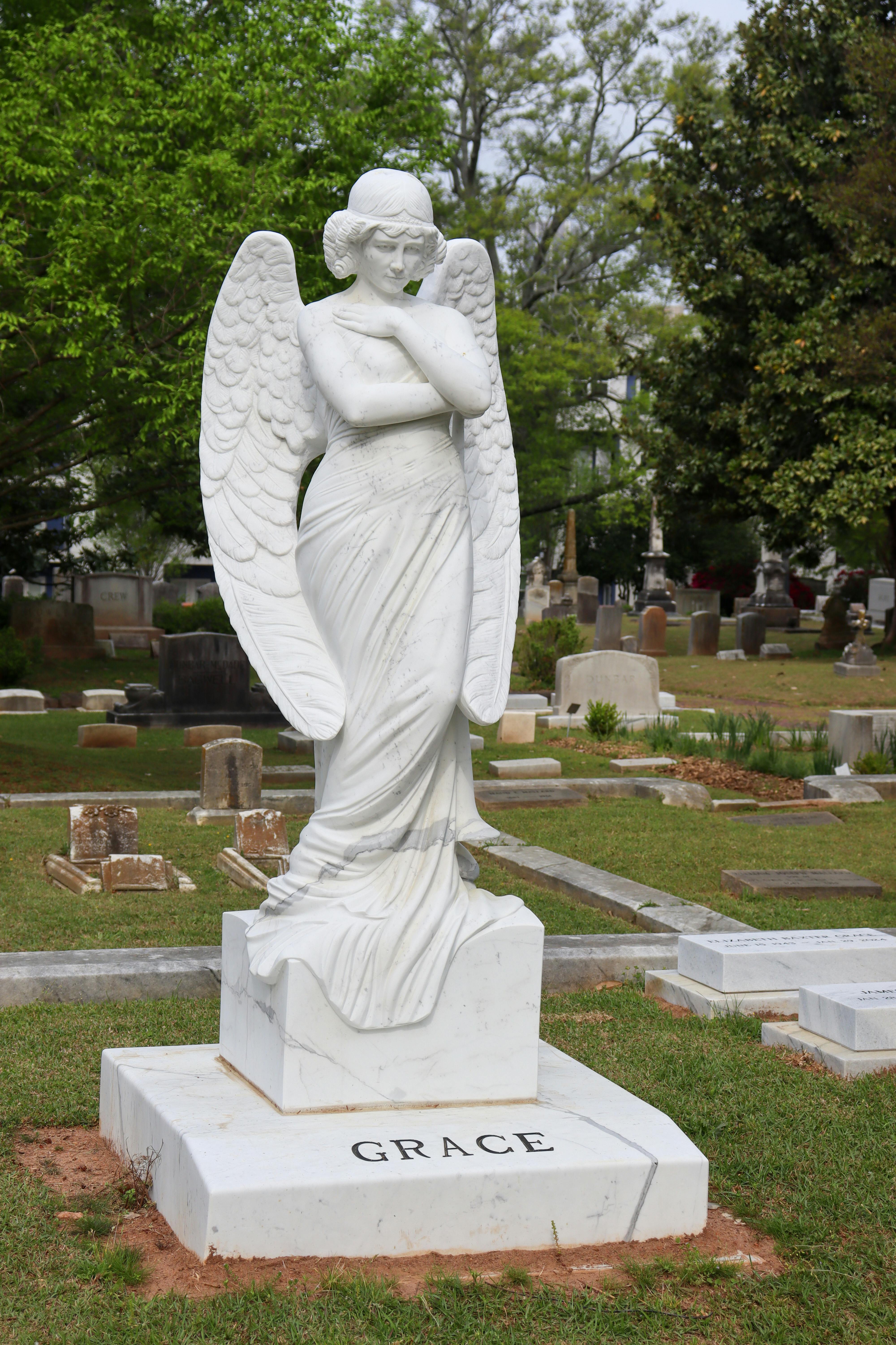 Stone Statue of Angel Standing by Cross · Free Stock Photo