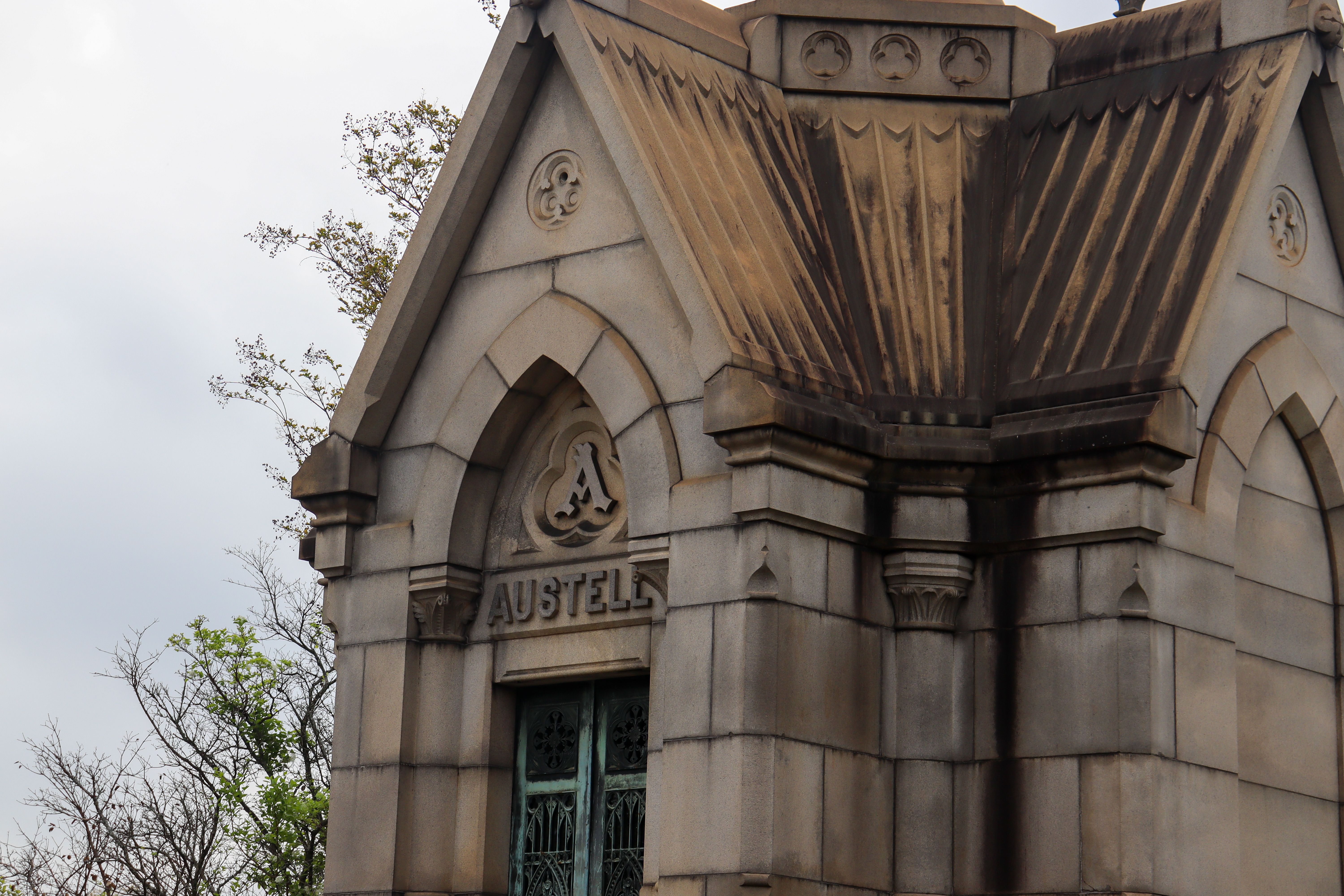 Close-up view of a historic mausoleum facade with intricate stonework.