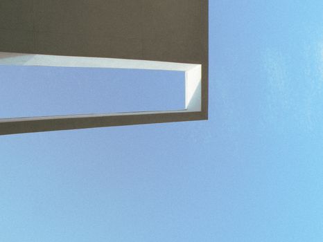 Modern abstract design of architectural frame against clear blue sky. — photo by Eveiewevie 🪿