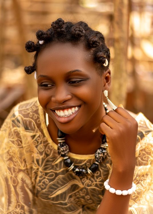 Smiling African Woman in Traditional Attire · Free Stock Photo