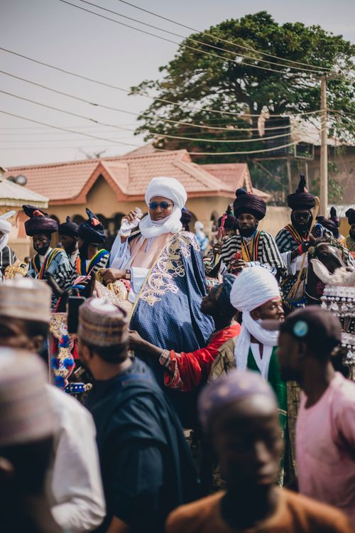 Free A vibrant outdoor parade showcasing traditional African attire and cultural expressions. Stock Photo