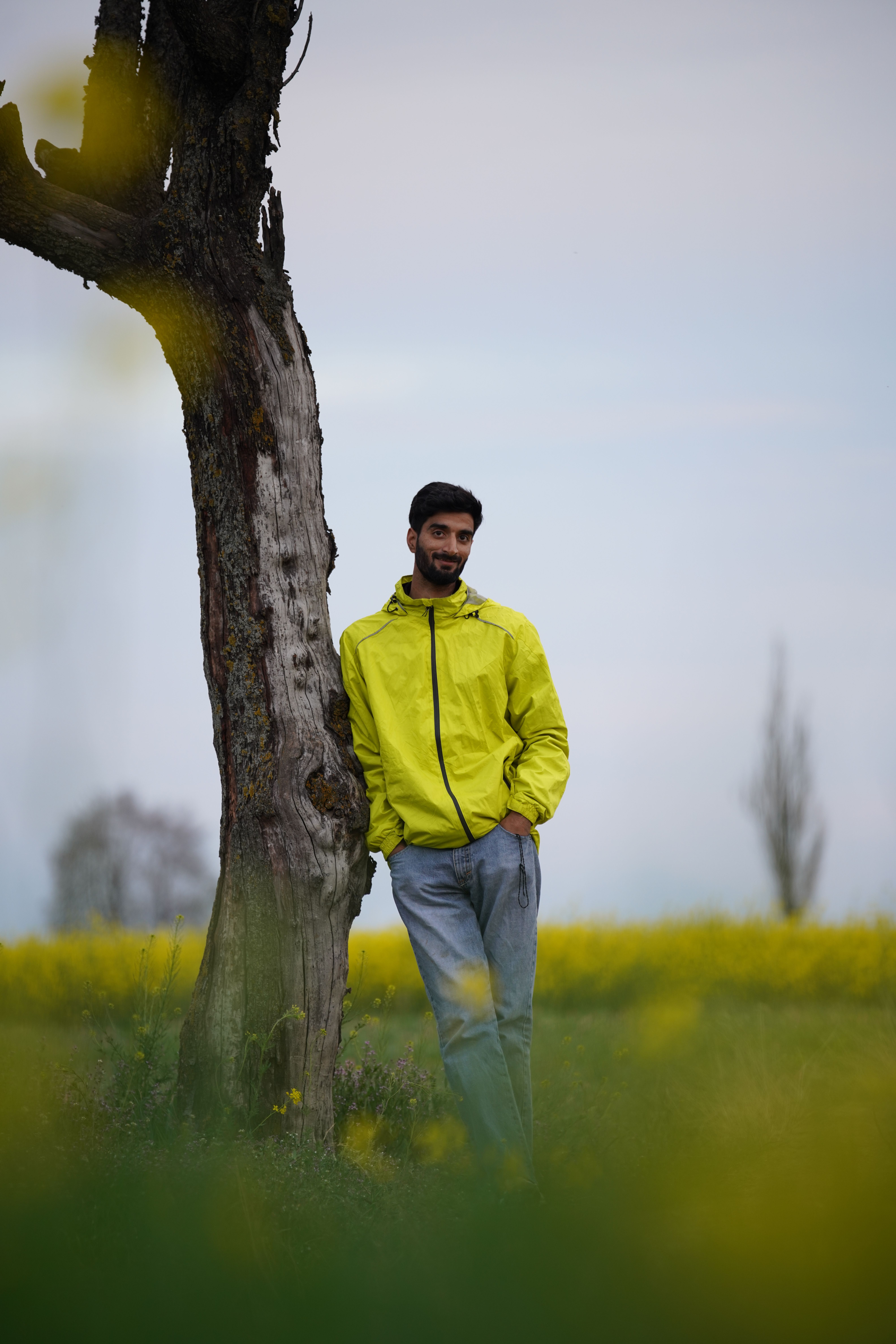 Man in Yellow Jacket by Tree in Field · Free Stock Photo