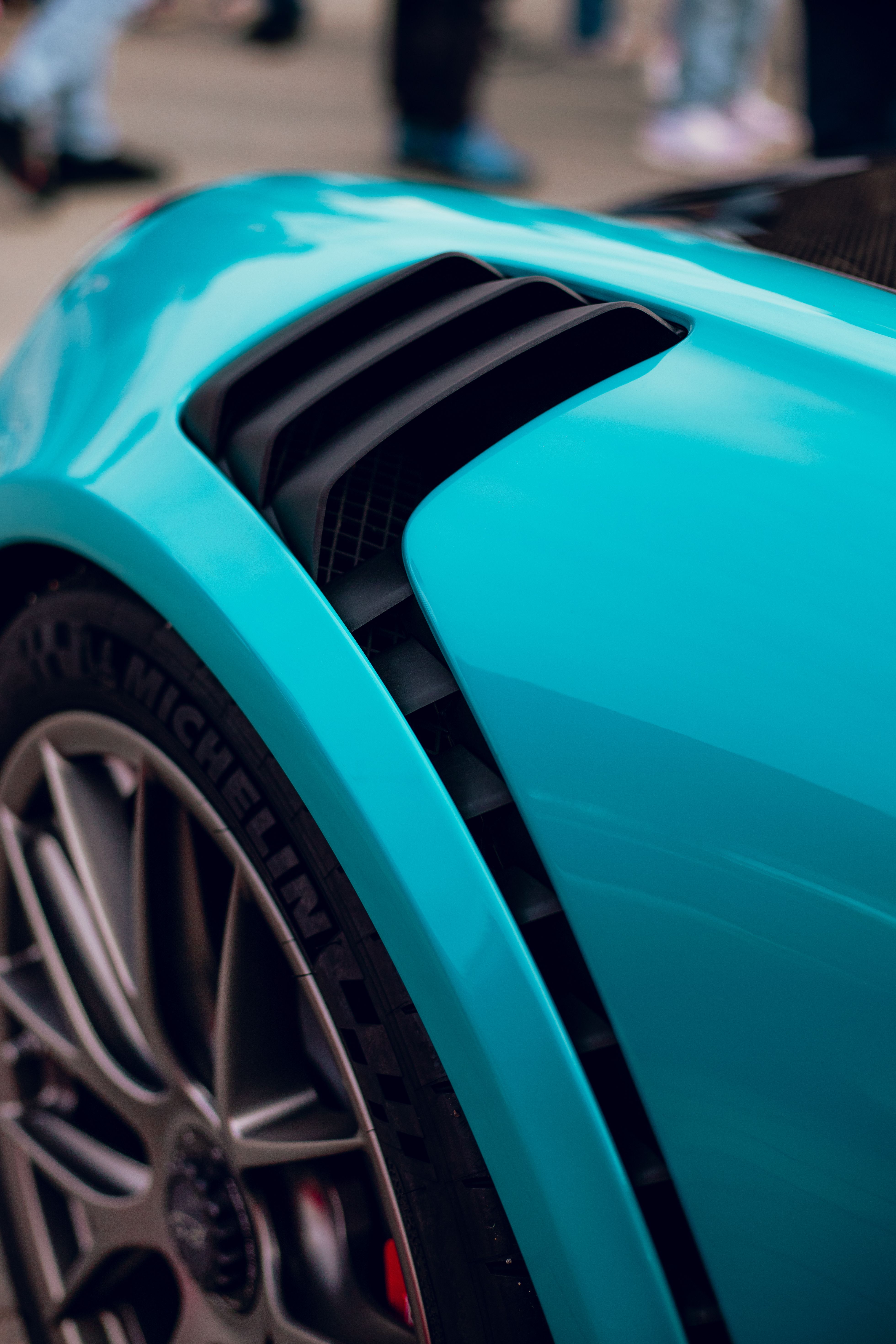 Close-up of Sporty Turquoise Car Wheel and Fender · Free Stock Photo