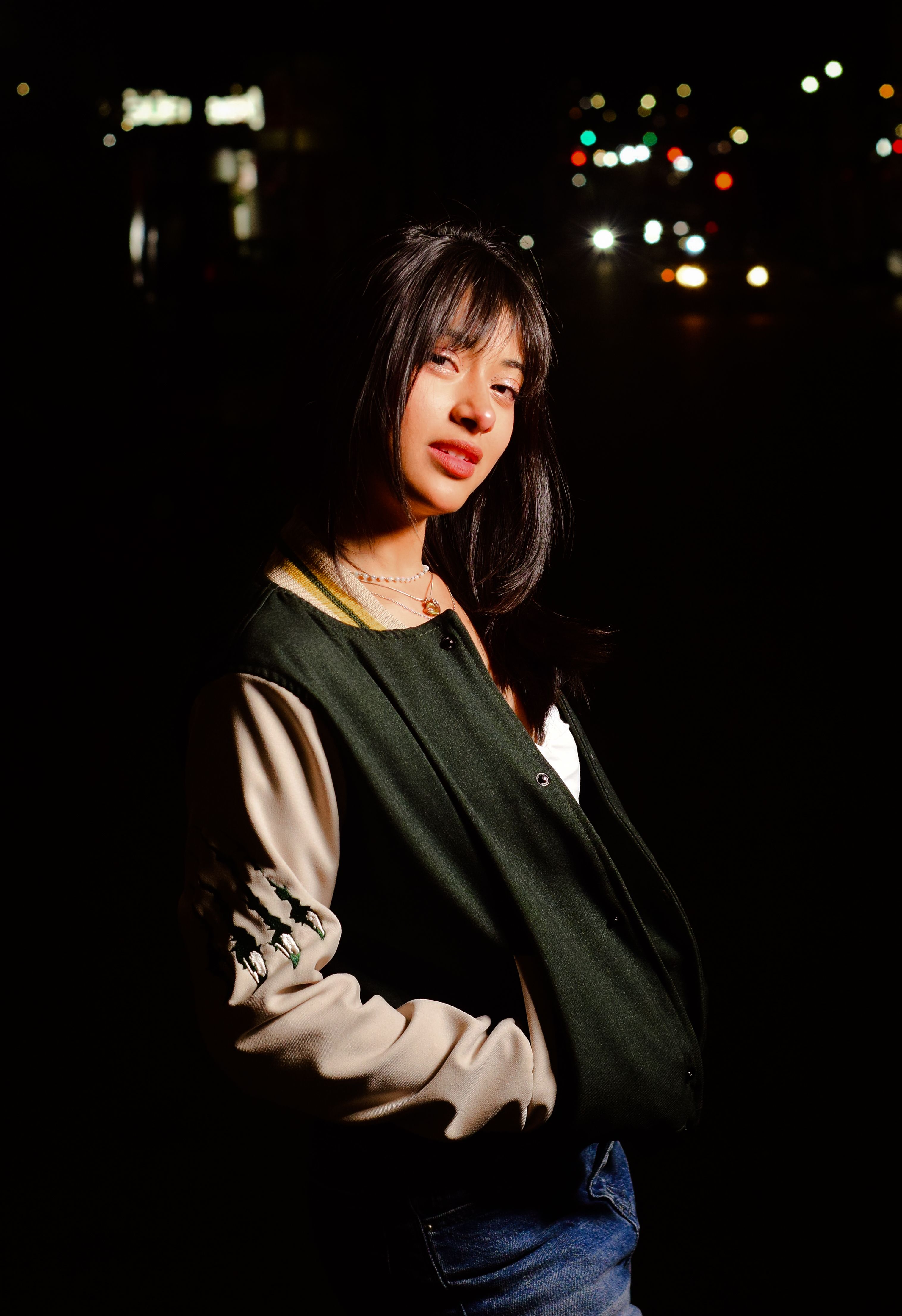 Young Woman Posing at Night in Urban Setting · Free Stock Photo