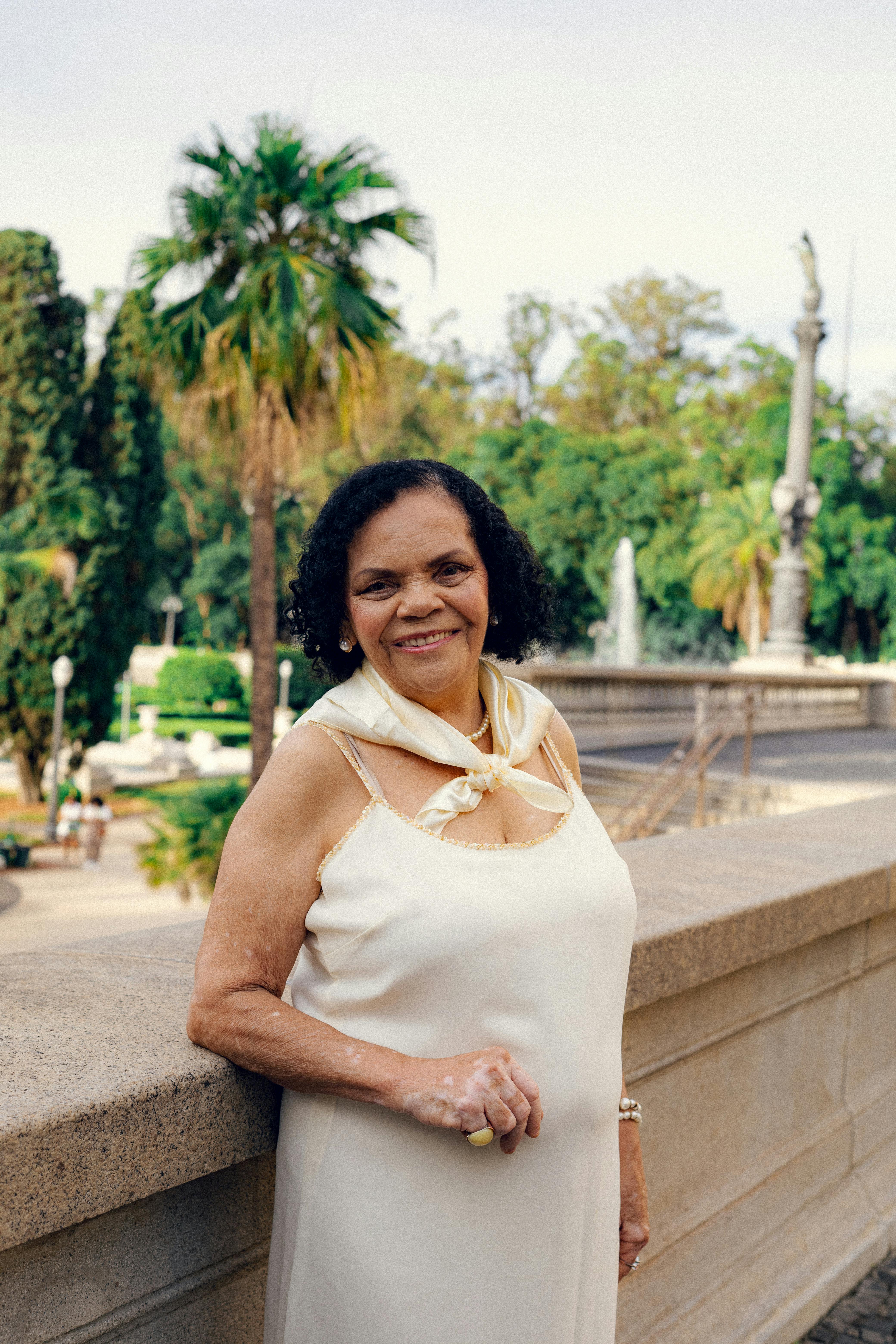 Senior woman smiling in São Paulo's Parque da Independência.