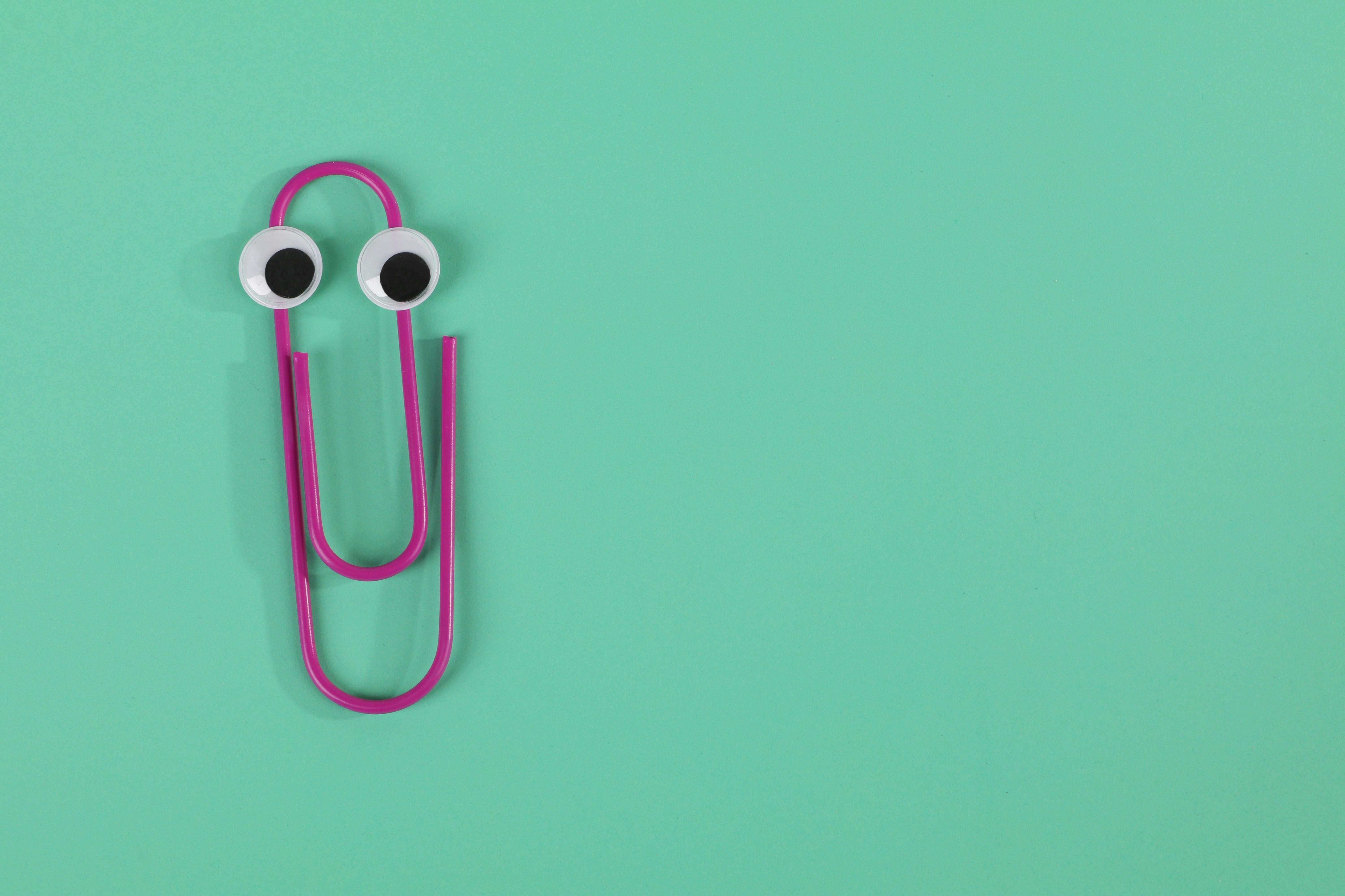 photo of purple paper clip on green background