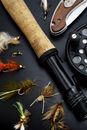 Black and Brown Fishing Rod Beside Hook And Brown Knife