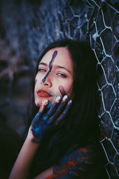 Photo of Woman With Face and Hand Paint