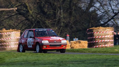 Free Exciting motorsport at Weston Park with a Peugeot 205 rally car racing through the course. Stock Photo