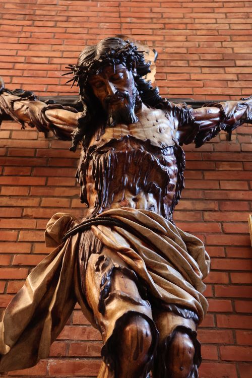Free Detailed wooden sculpture of Christ on the cross in El Puerto de Santa María, Spain. Stock Photo