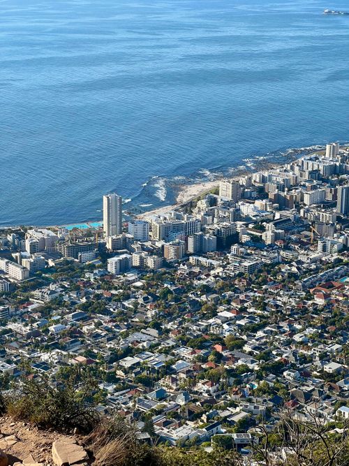 Free Breathtaking aerial view of a coastal city with the ocean in the background. Stock Photo