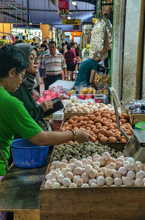 Free Photo Of People Standing In Front Of Vegetable Stall  Stock Photo