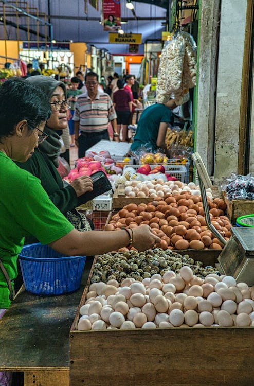Free Photo Of People Standing In Front Of Vegetable Stall  Stock Photo