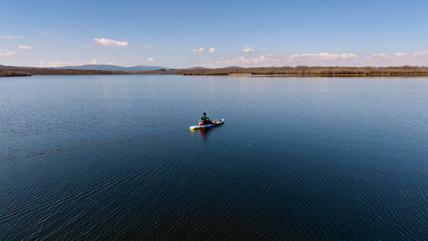 Solitary paddling on a tranquil lake