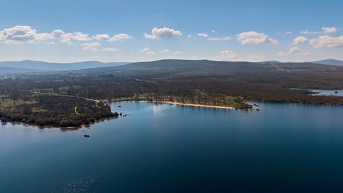 Free Stunning aerial view of a serene lake surrounded by lush landscapes in Zamora, Spain. Stock Photo