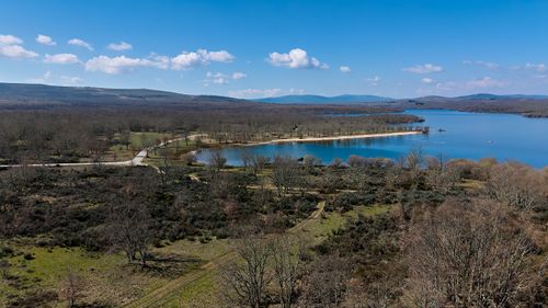 Free A tranquil aerial view of a lakeside landscape in Zamora, Spain with clear skies. Stock Photo