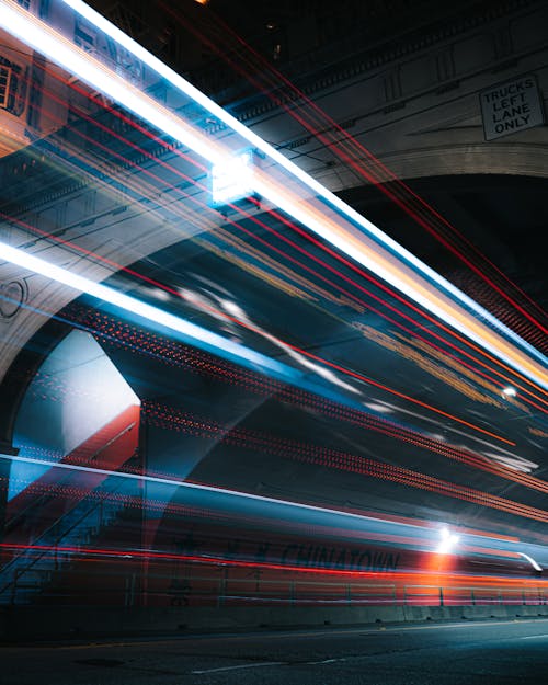 Time Lapse Photography of Light Streaks on Road during Night Time