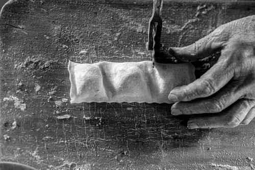 Free Black and white photo of hands crafting dough on a floured surface. Stock Photo