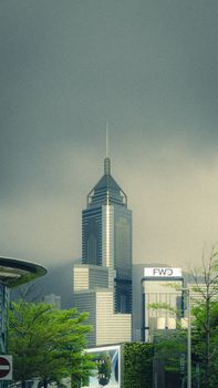 A striking skyscraper stands tall amidst stormy clouds with green foliage in foreground.
