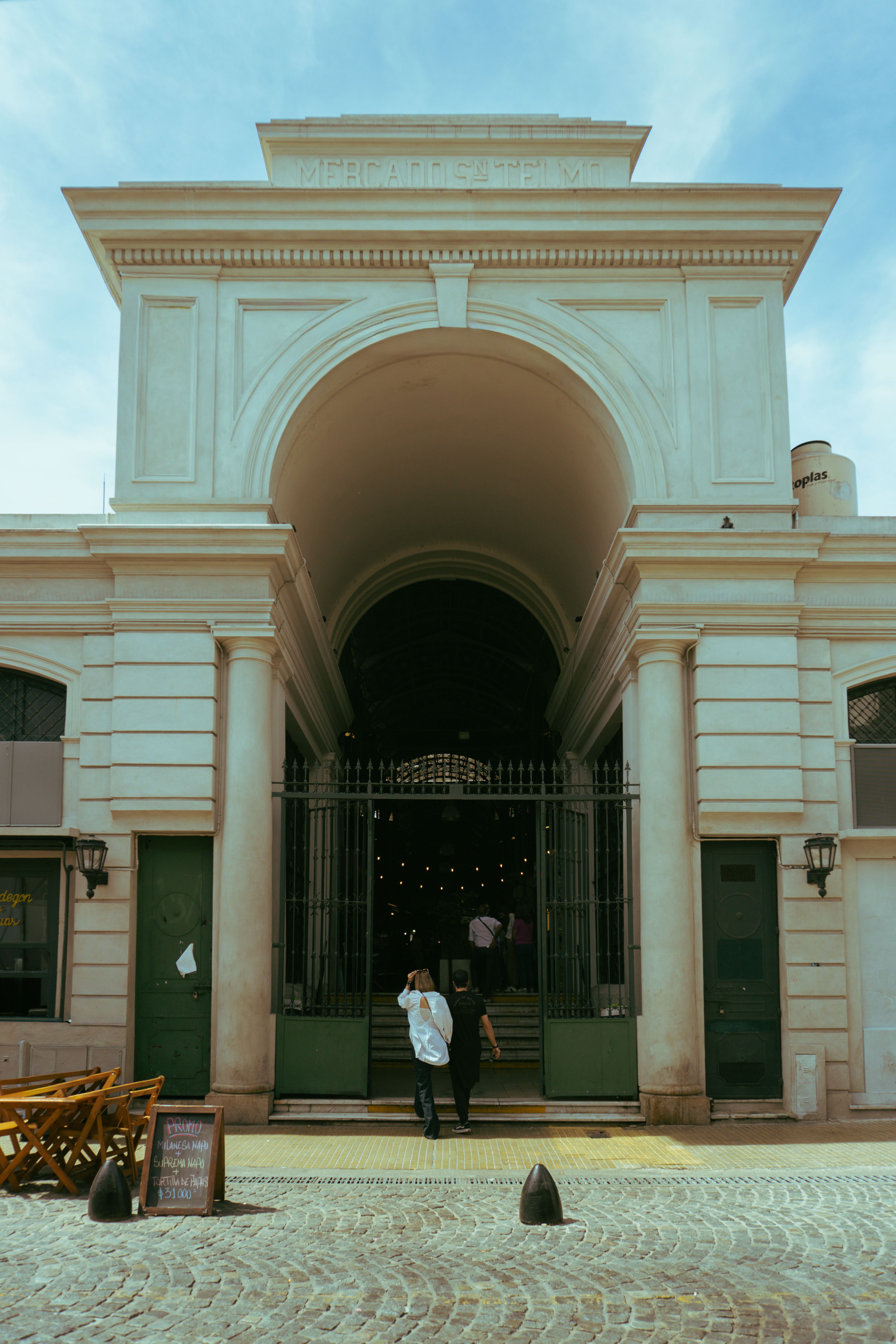 The entrance archway to the iconic San Telmo Market in Buenos Aires, showcasing architectural elegance.