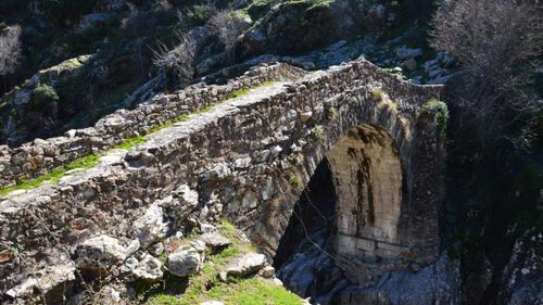 Free Historic Genoese stone bridge in Asco, Corse, France. Scenic landscape view. Stock Photo