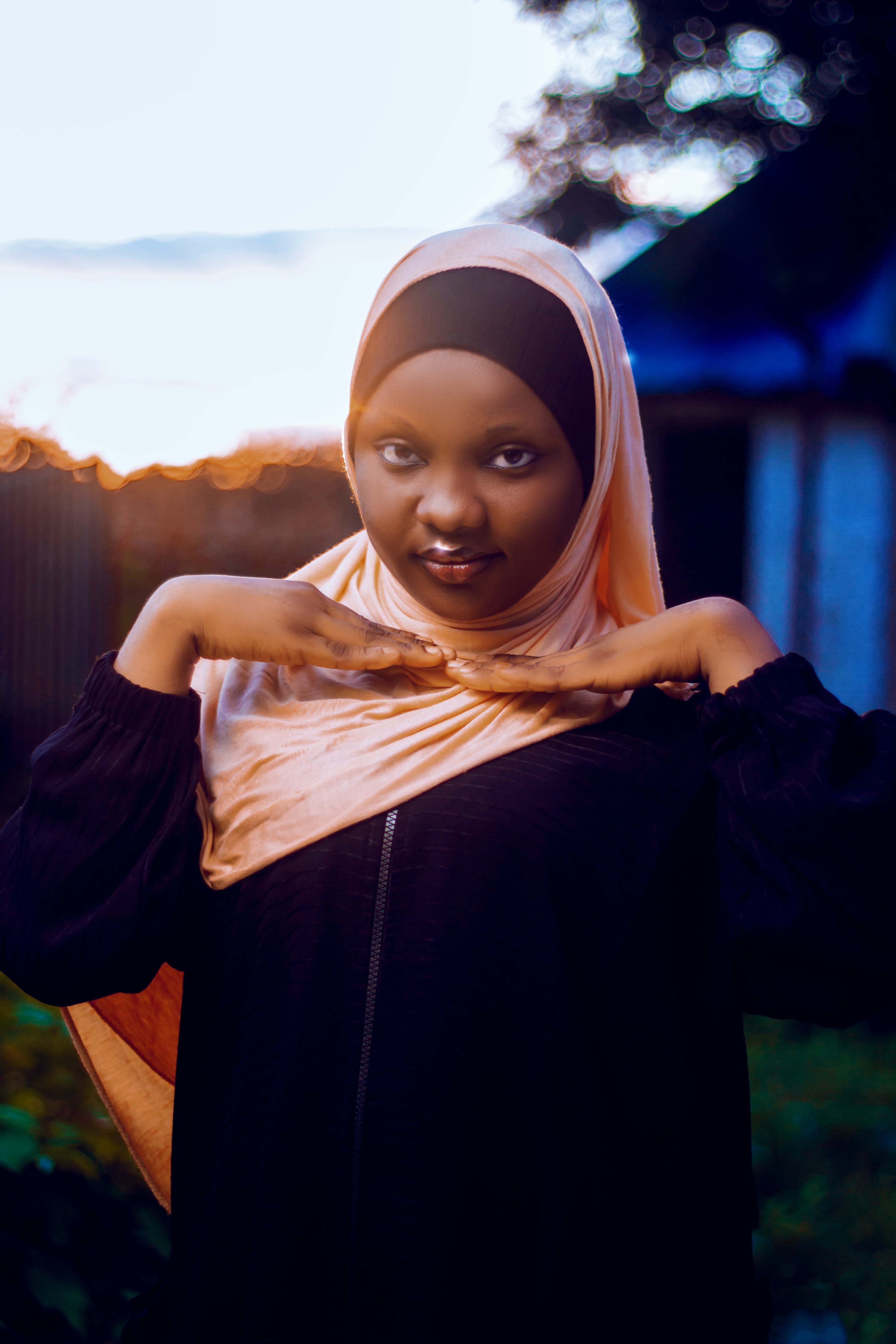Young Woman in Hijab Posing at Sunset · Free Stock Photo